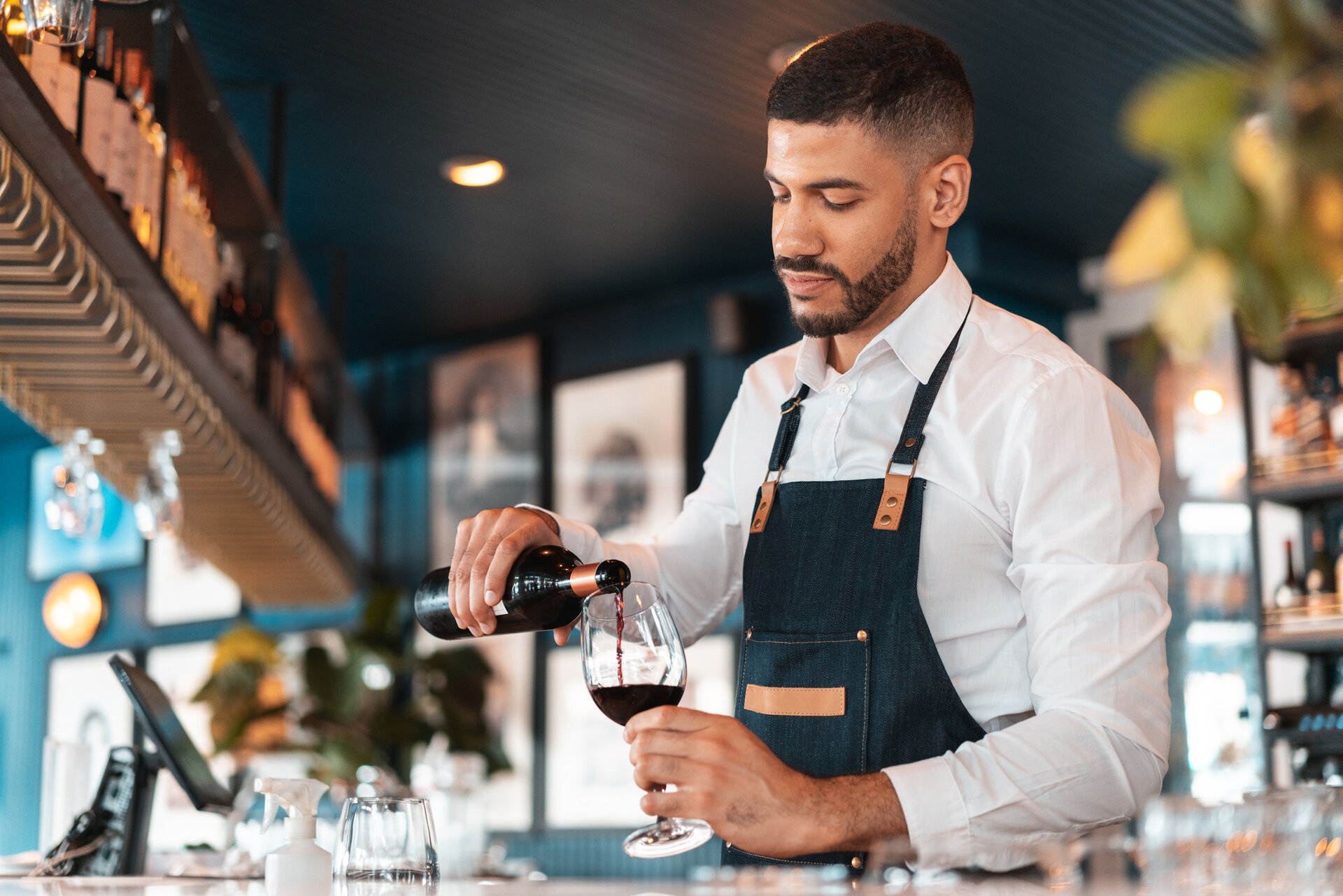 waiter pouring wine